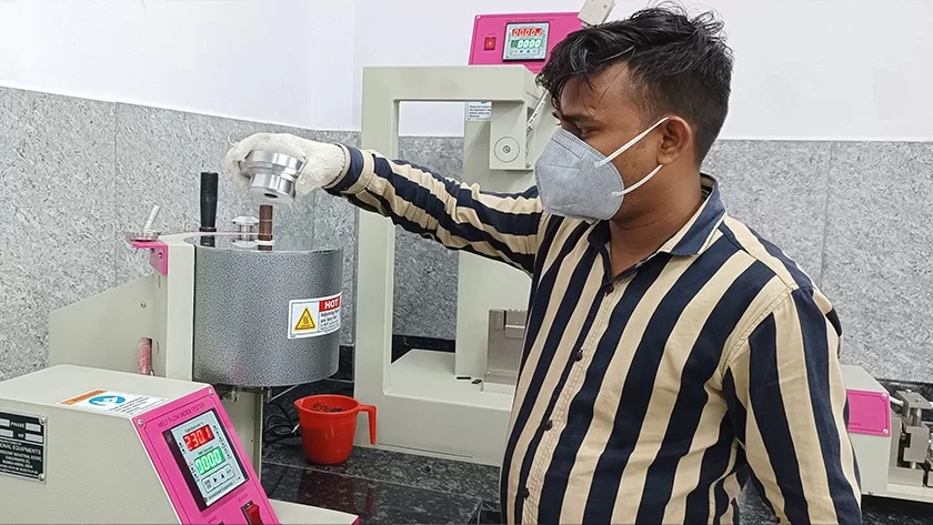 Deshwal technician operating laboratory testing equipment