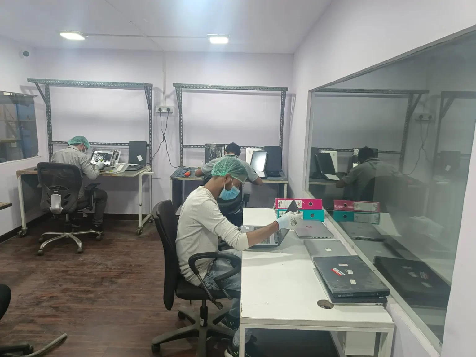 Deshwal staff working at laboratory workstations