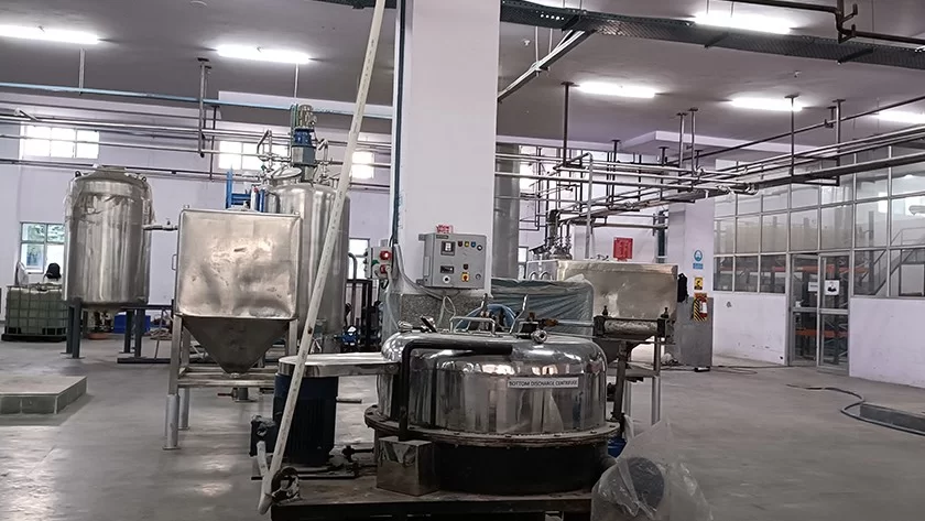 Stainless-steel processing vessels on the Deshwal plant floor